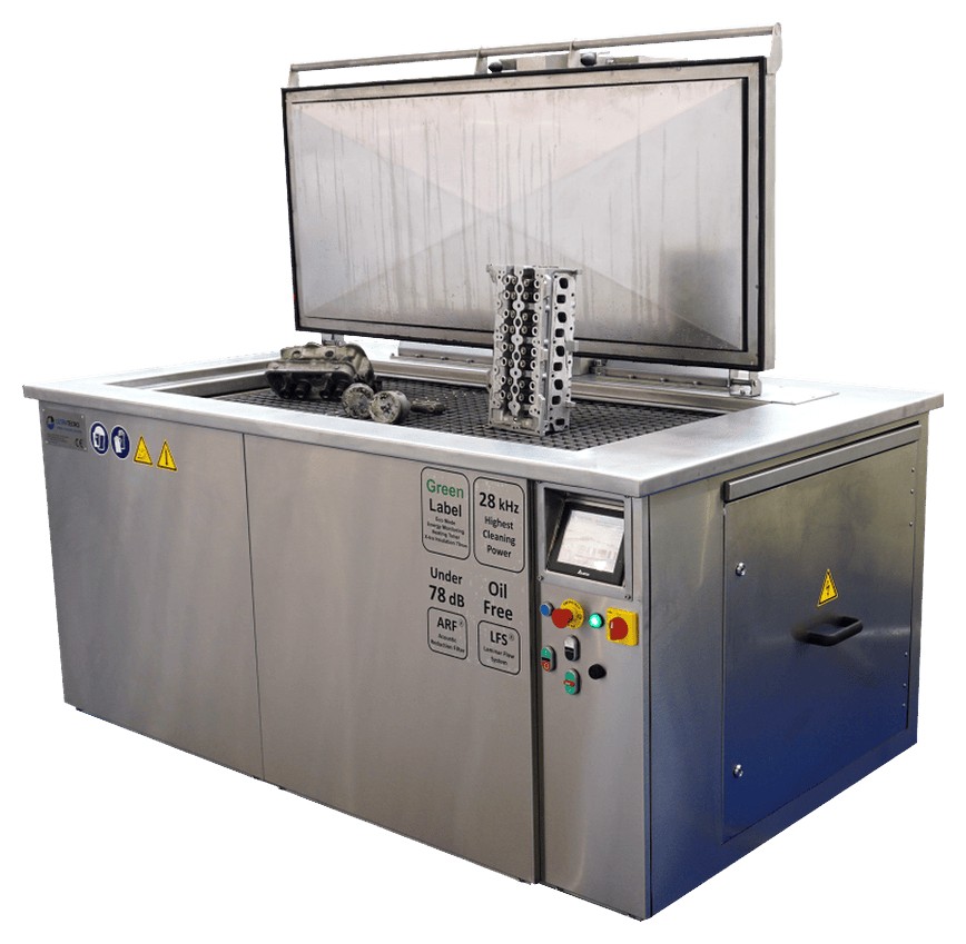 UltraTecno ACM heavy-duty ultrasonic cleaning machine with the insulated lid open and a cylinder block on the platform lift