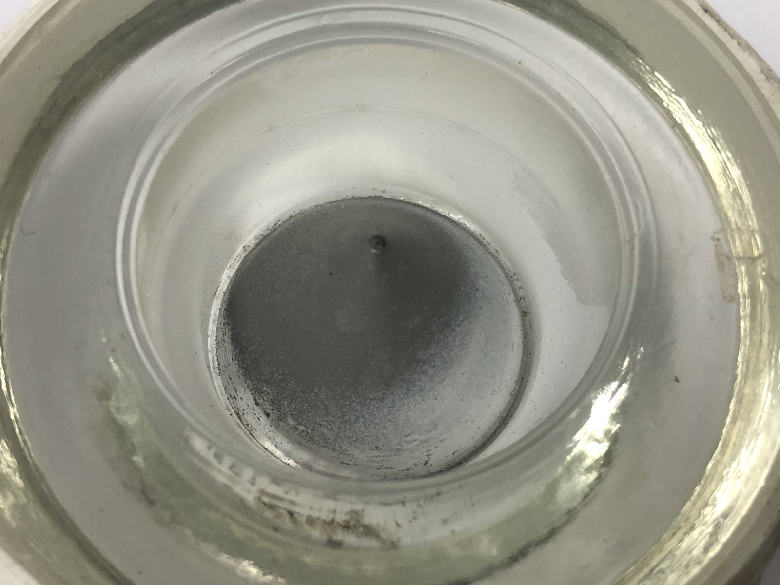 Airfield light lens as received, centre optic obscured by cooked deposit
