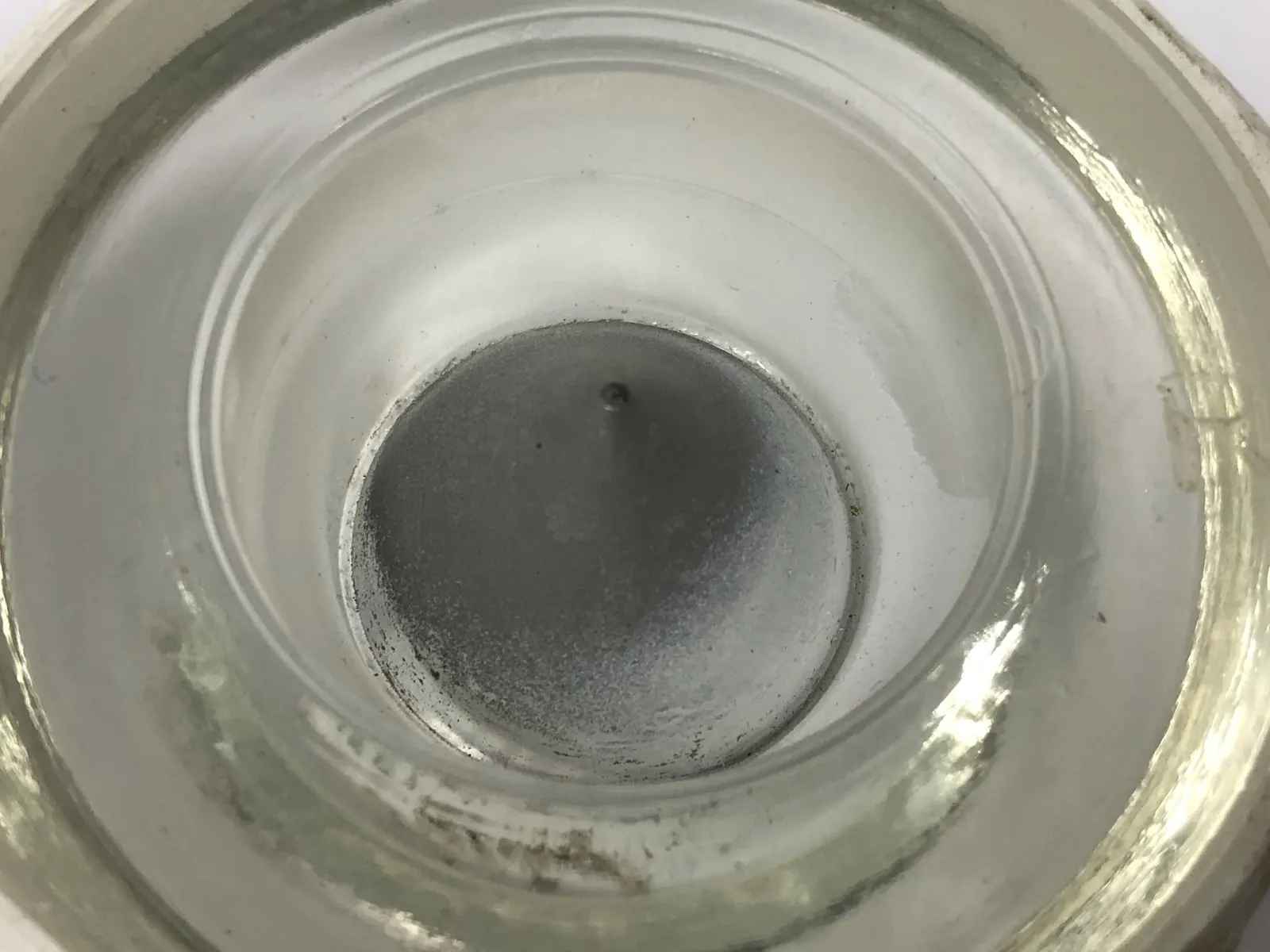Airfield light lens as received, centre optic obscured by cooked deposit