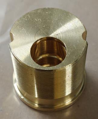 The same component after the three-stage cycle — threads clear, uniform bright finish.