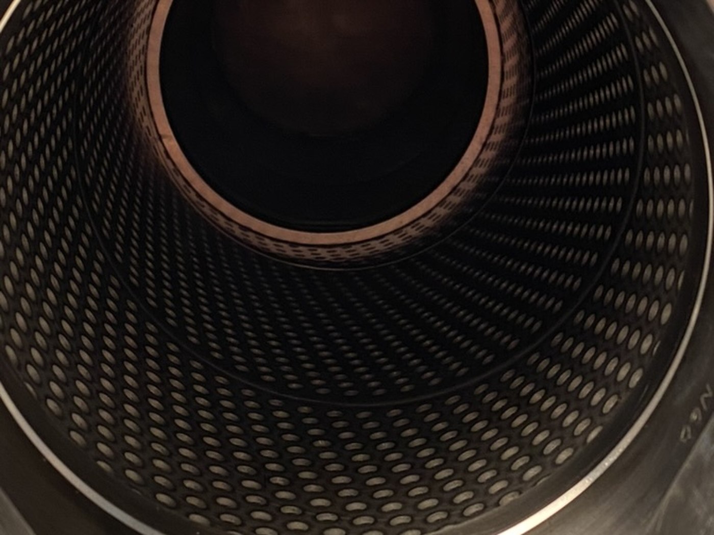 Looking into the element: the perforated stainless core inside the pleat pack