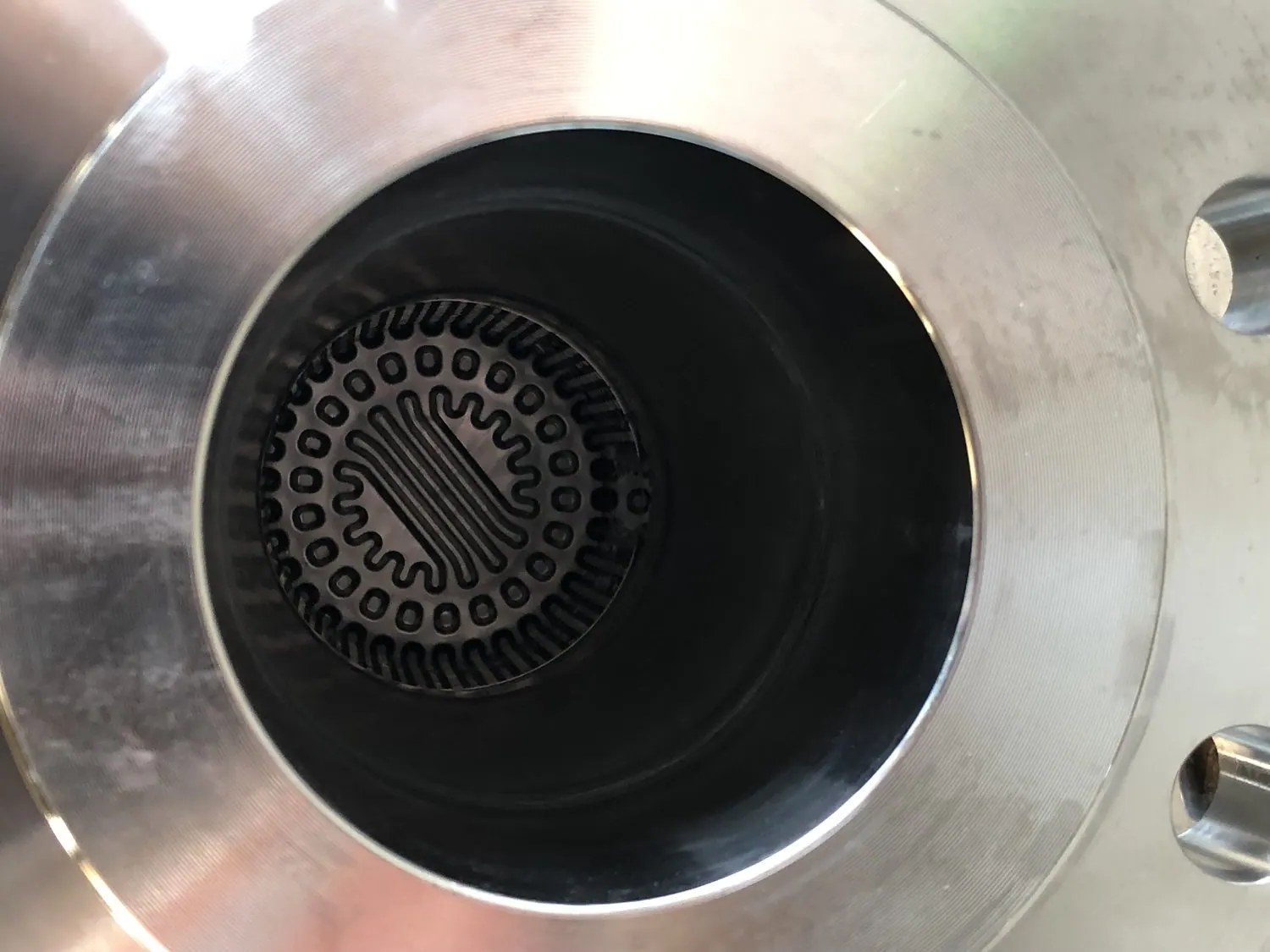 The same heat exchanger tube ends open and clean after ultrasonic immersion