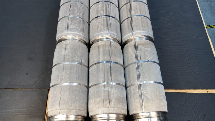Pleated stainless mesh filter elements cleaned and laid out on the bench