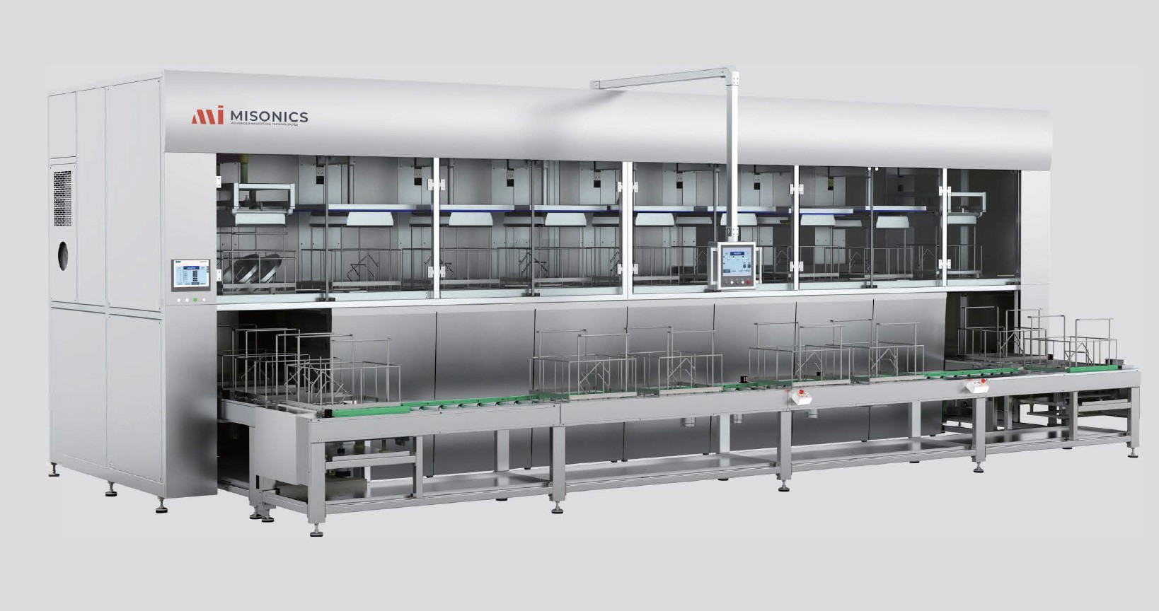 Misonics CM series multi-stage ultrasonic cleaning line — enclosed process stages above, conveyor transport running the length of the machine below
