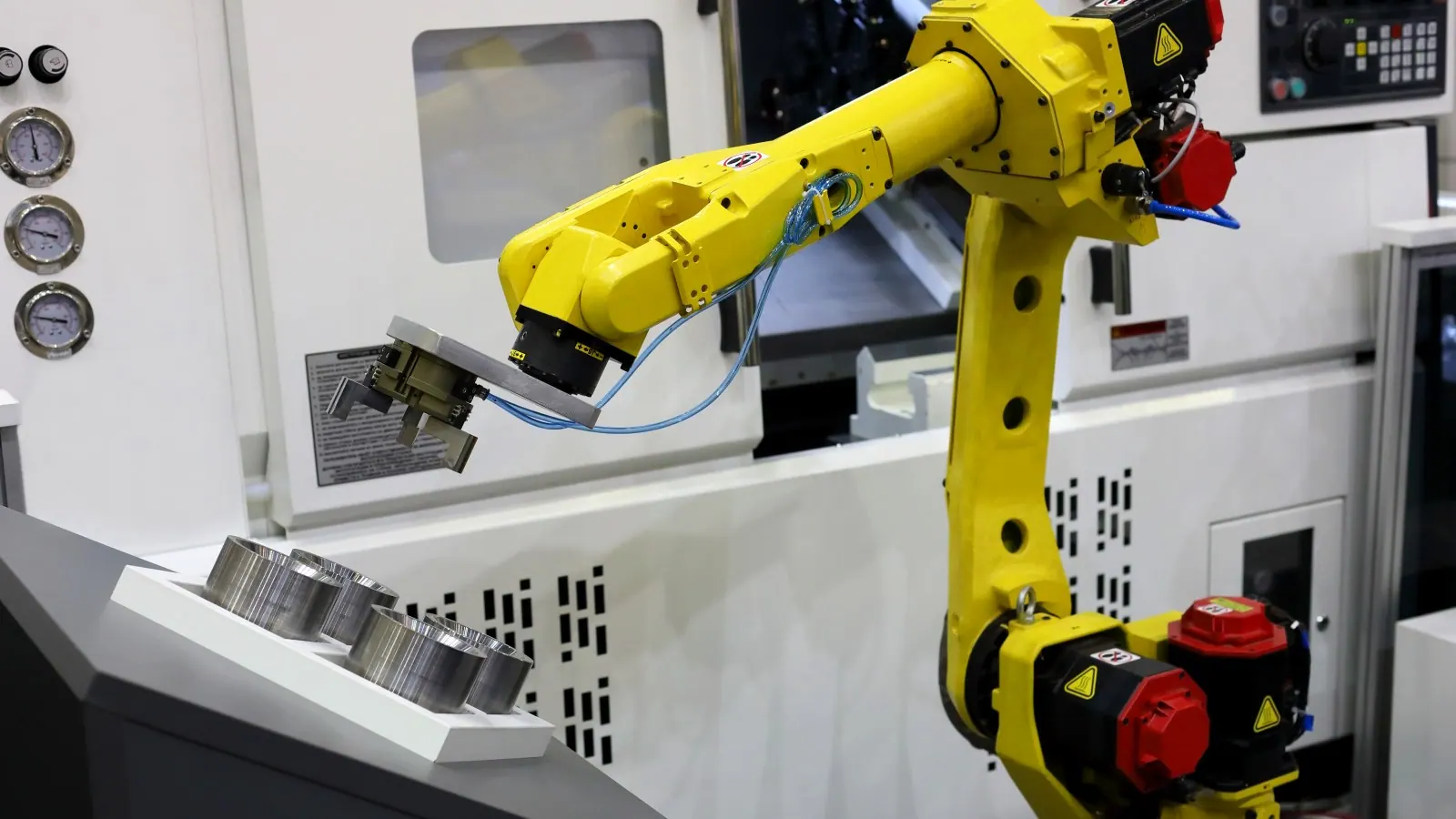 Industrial robot tending a CNC machine