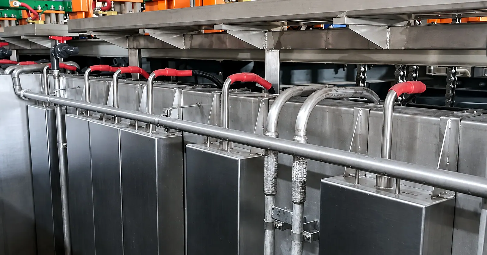 Immersible transducer boxes fitted around the existing pipework of a plating line