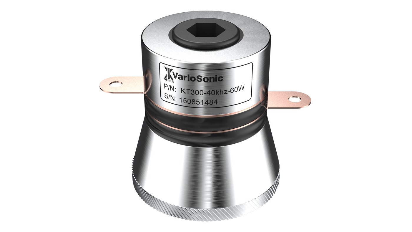 A 40 kHz bolt-clamped Langevin transducer — hex bolt through the steel back mass, ceramic stack under the black band, copper terminals, aluminium horn