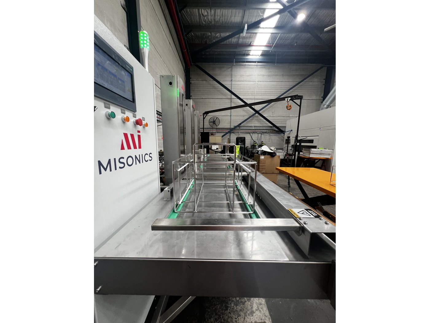 Looking along the stations of a Misonics Sono L-130 three-stage ultrasonic cleaning line