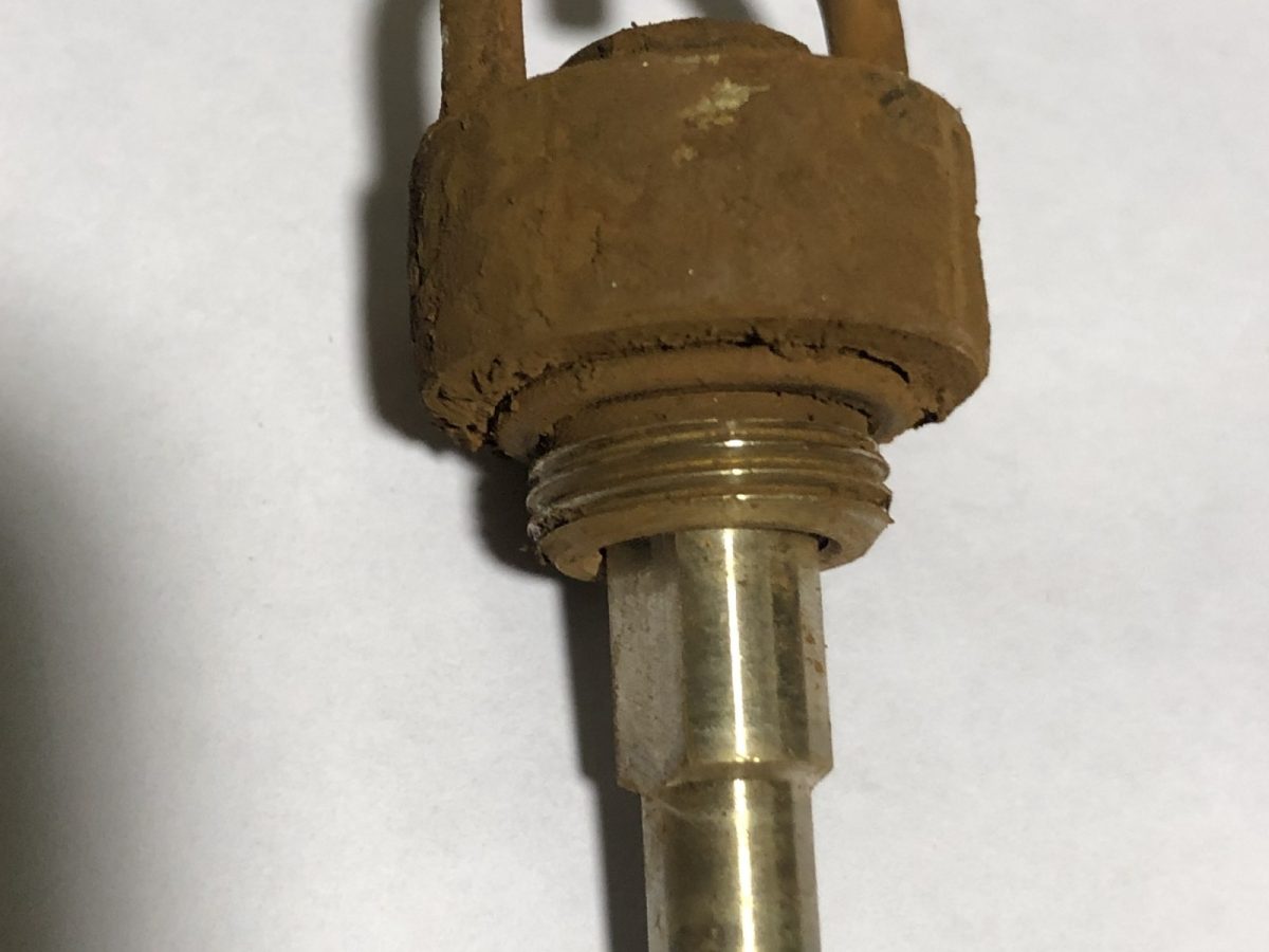 Brass dust suppression nozzle — before and after ultrasonic cleaning — as received