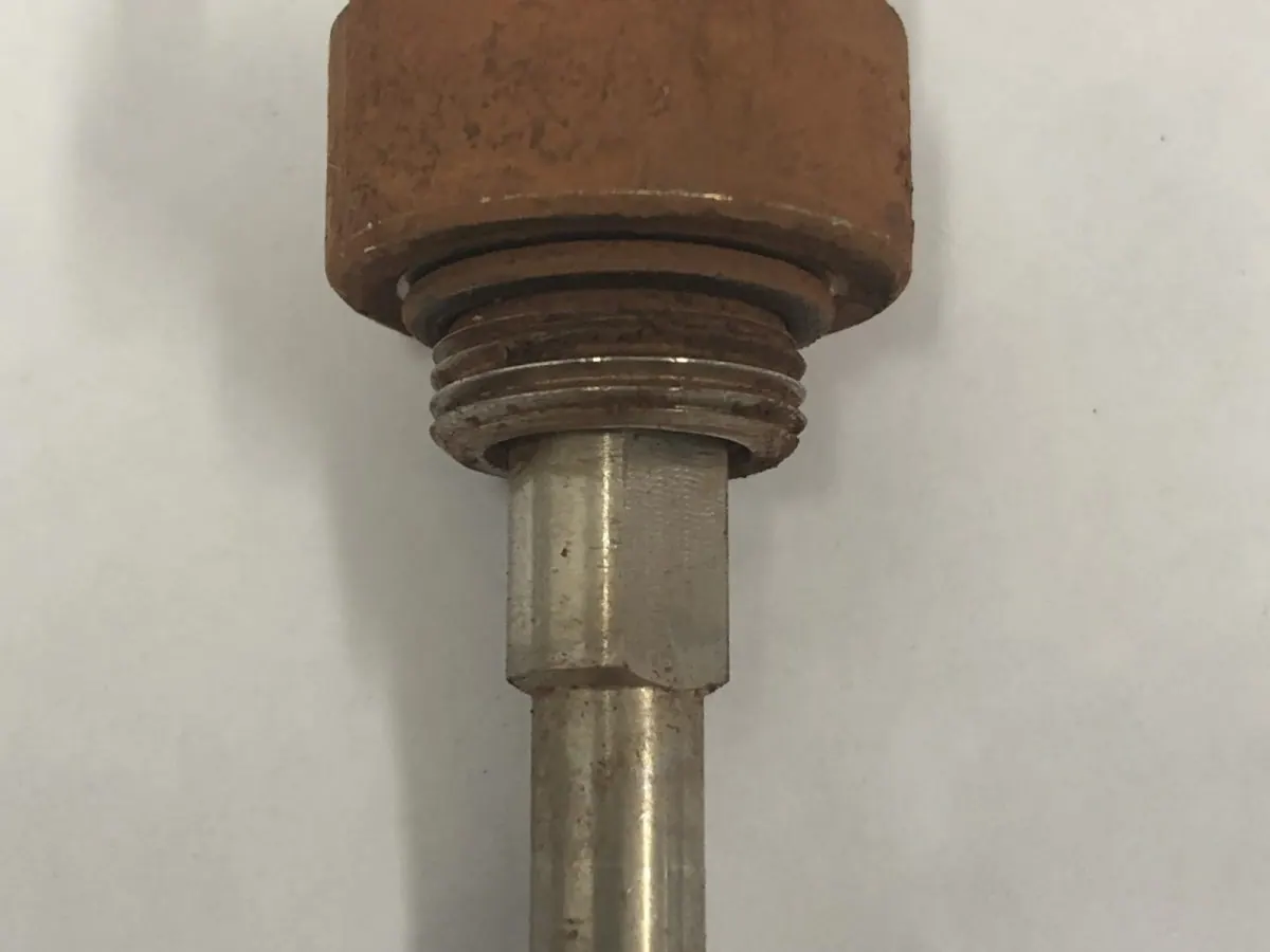 Mine-site dust suppression nozzle sheathed in mineral scale