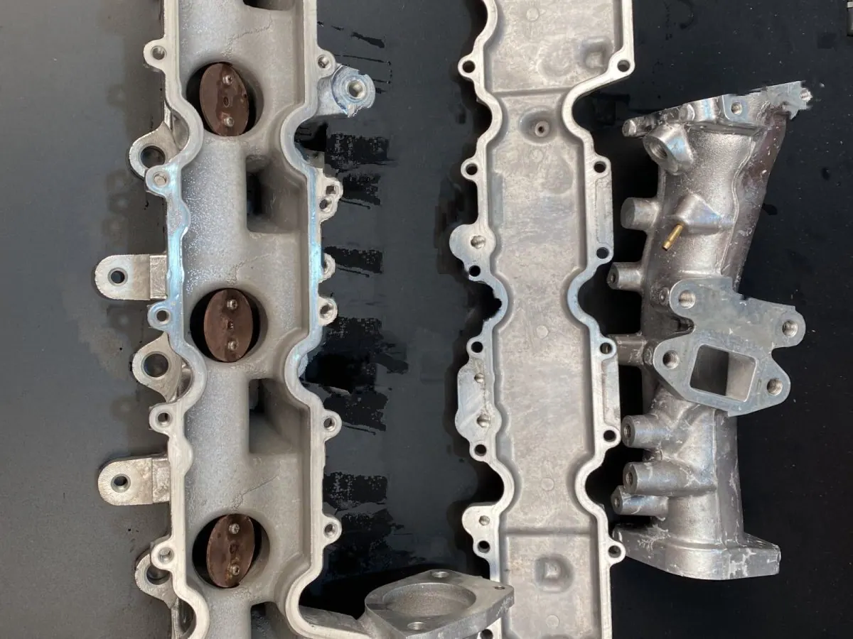The same castings after a programmed cycle. The metal underneath is bright.