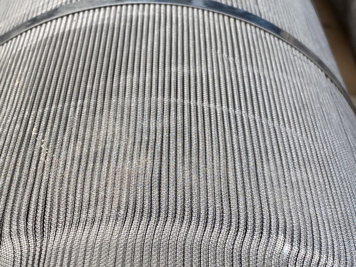 The same element after ultrasonic cleaning, every pleat open and the wire weave visible