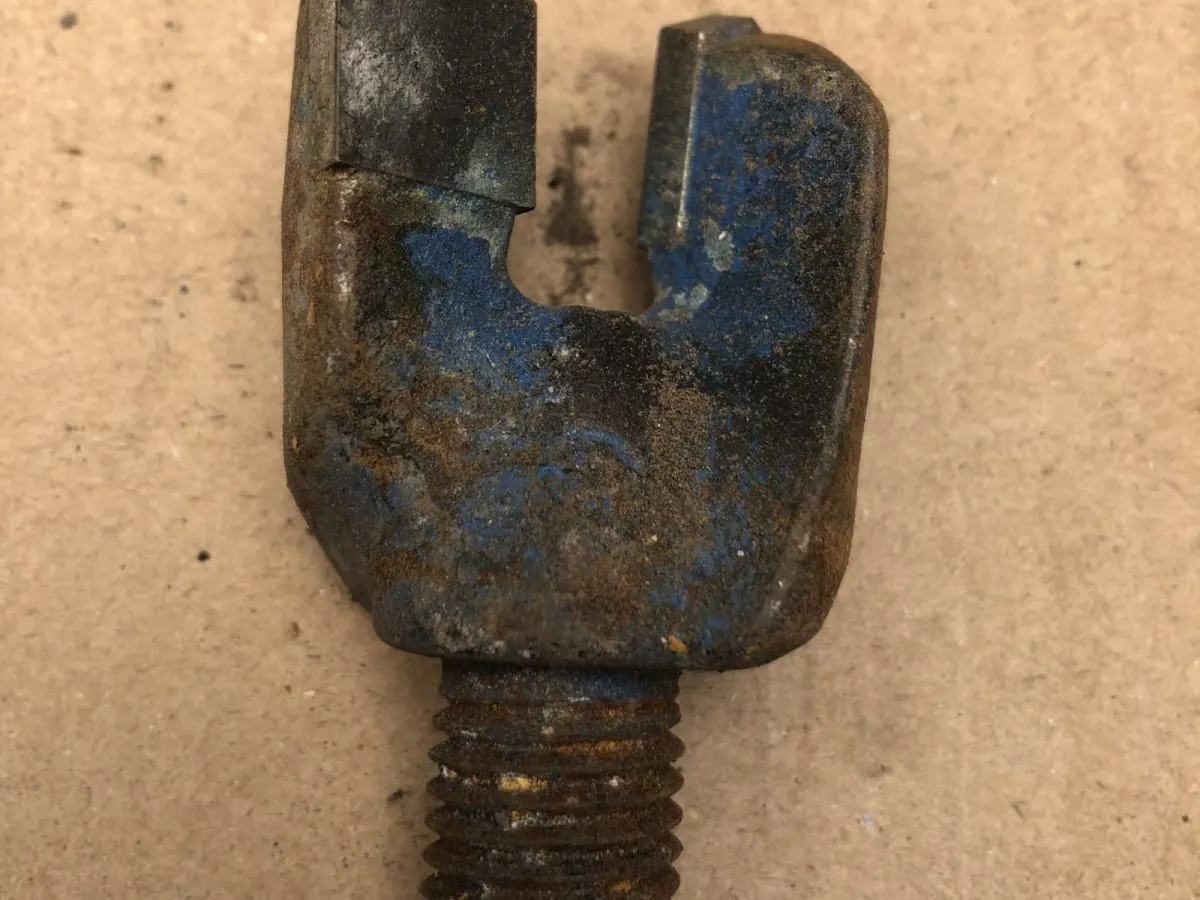 Drill pick holder as recovered, with rock dust, grease and corrosion