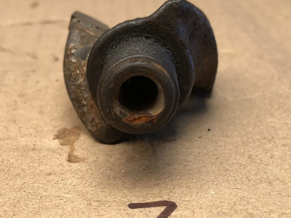 Pick holder bore packed with scale and fines