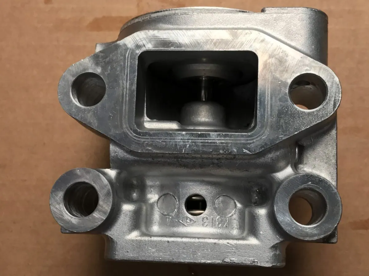 The same port after the cycle, with the as-cast surface unmarked.