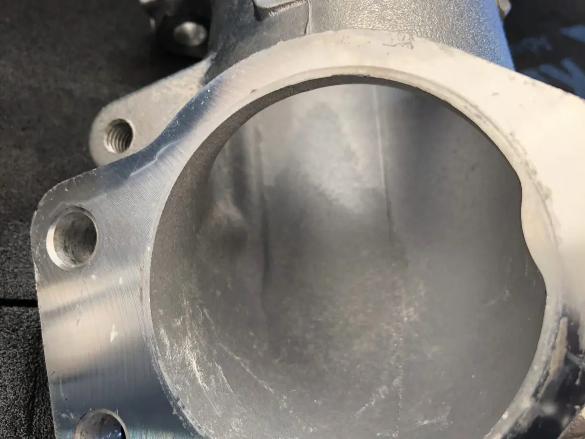 The same bore, back to clean aluminium with the machined finish intact.
