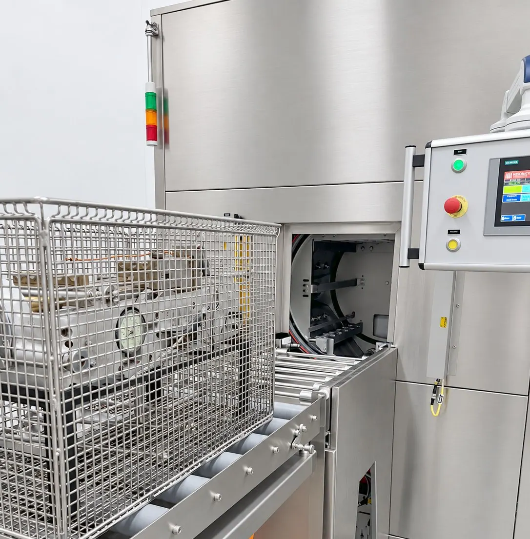 UltraWash — loaded basket on the roller conveyor, chamber open