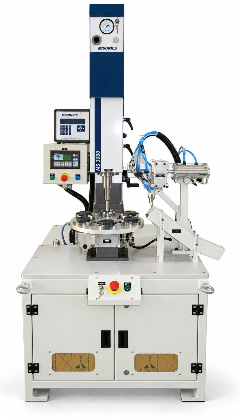 A Misonics MS 3000 welding head on a six-station rotary indexing table with a pneumatic feed arm, guarding and a PLC panel