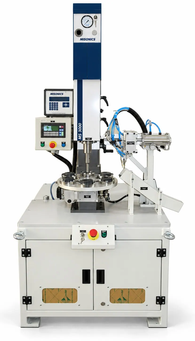 A Misonics MS 3000 welding head on a six-station rotary indexing table with a welded-part ejection mechanism, guarding and a PLC panel